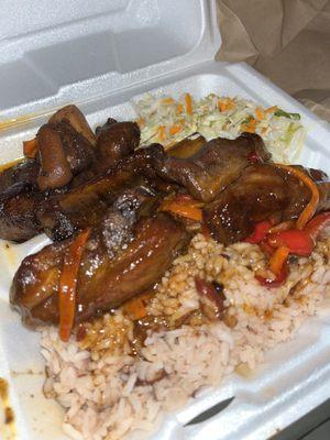 pigs tail & short ribs over rice & peas, side of coleslaw