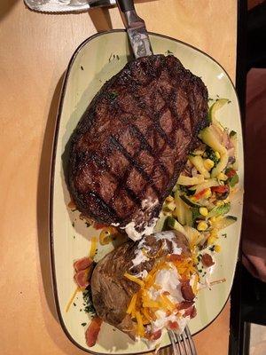 Ribeye Steak with Baked Potato and Sautéed Vegetables