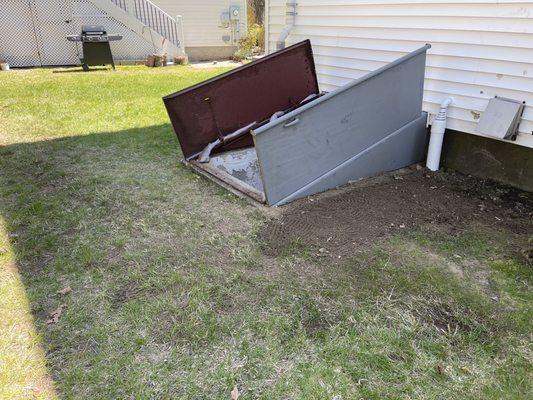 Before of bulkhead and after showing sump pump exhaust (white cylinder)