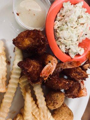 Coconut shrimp, crinkle fries& slaw.... But it is the coconut sauce