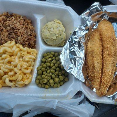 Fried fish, Mac and cheese, dirty rice, and sweet peas