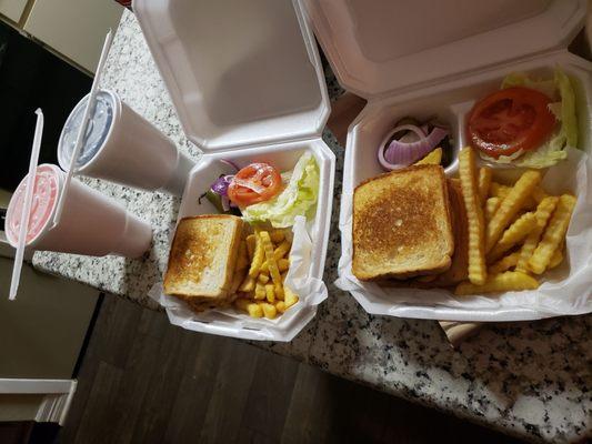 Double meat hamburgers,fries and last but not least KOOL-AID (One grape and pink lemonade)