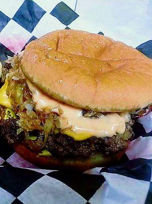 Reuben Burger:
Our delicious 7 oz cheeseburger topped with grilled sauerkraut and onions with Thousand Island dressing