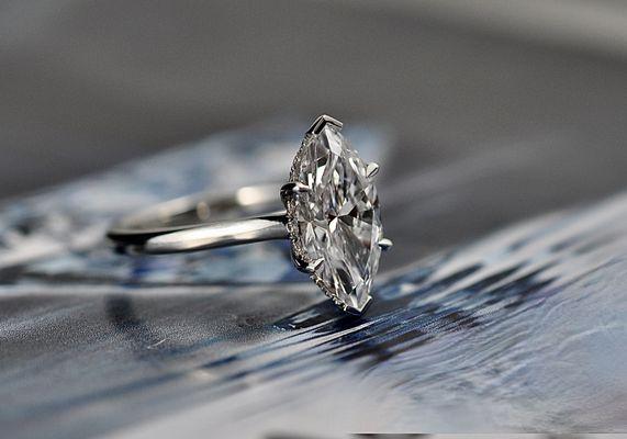 Hidden halo Marquise diamond engagement ring.