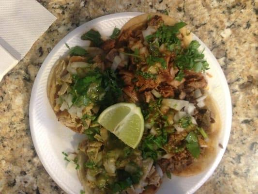 Left: two chicken tacos. right: pork up-top, Carne-asada down-low.