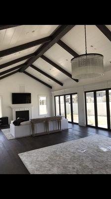 Custom exposed beams, custom tongue and groove ceiling and wall panels with crown moulding