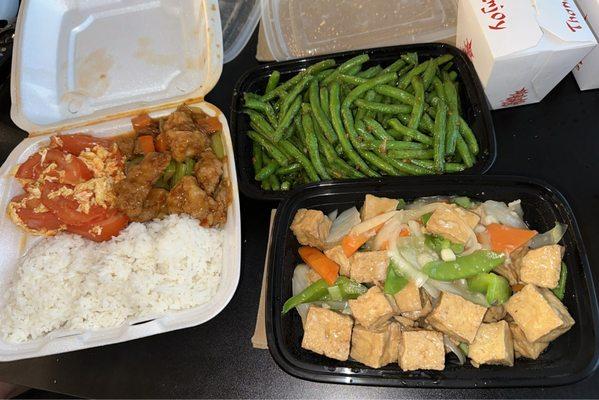 Stir fried tomato with egg, dry sautéed green beans, homestyle stir fried tofu