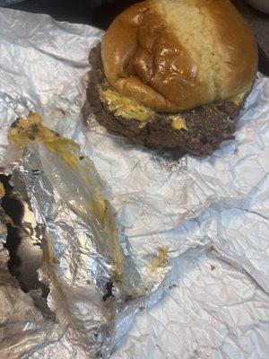 Paper was torn/stuck to the meat. The burger is not smash and the edges are not crispy and undercooked