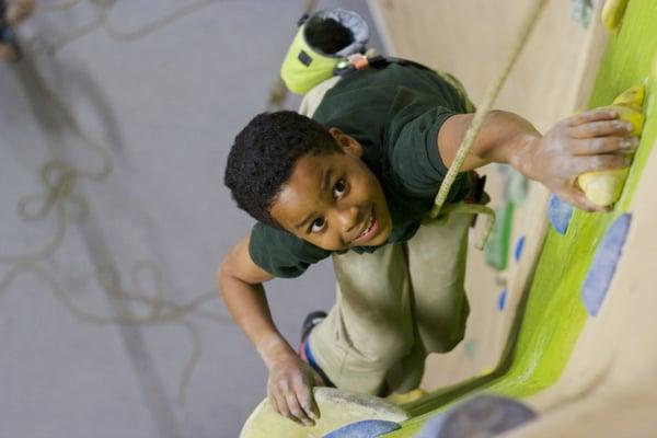 Kid climbing in the Top Rope Room at High Point