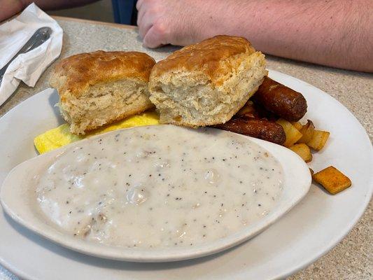 Classic biscuits and gravy with added sausage and eggs