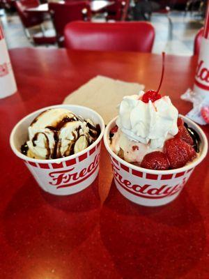 VANILLA SUNDAE WITH CHOCOLATE SYRUP, VANILLA BROWNIE SUNDAE WITH HOT FUDGE, STRAWBERRIES, WHIP CREAM AND A CHERRY