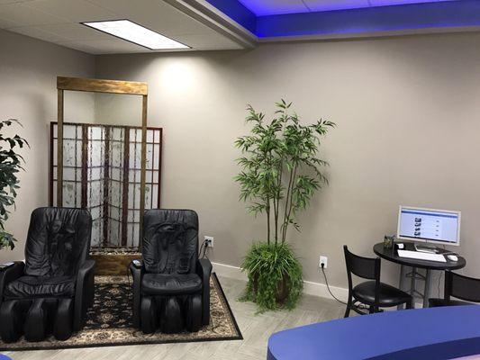 Massage chairs and one of the computer areas.