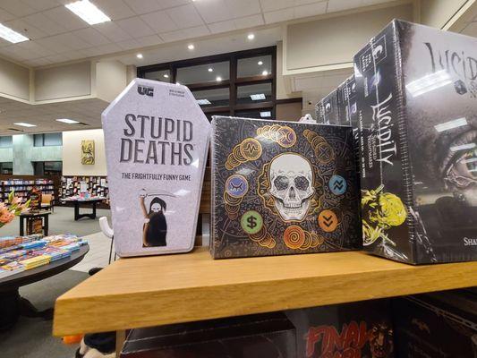 Halloween book & game display, books + chairs and benches for reading in background