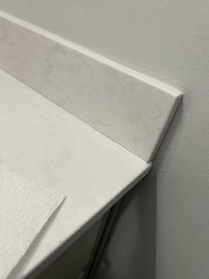 Backsplash is not aligned with vanity countertop