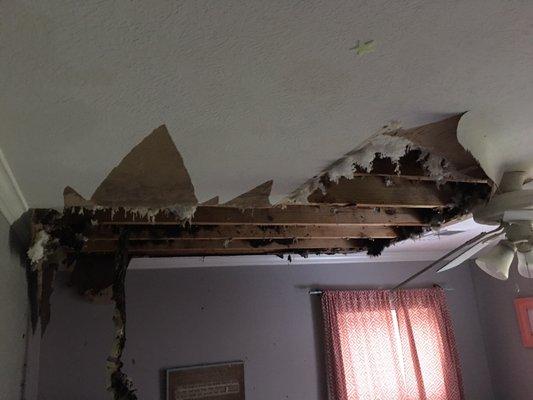 Ceiling caved in after damage.