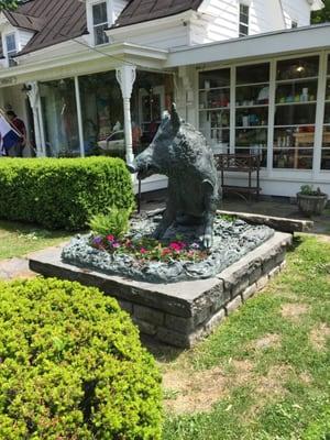 Statue in front of store.