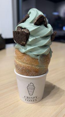 Mint ice cream with a traditional cone and Oreo toppings! Delicious.