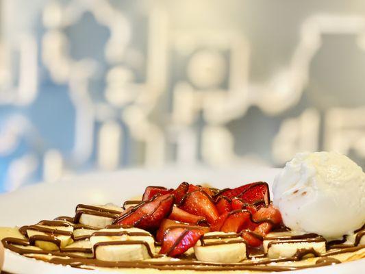 Crepe, banana and strawberry, topped with Nutella and vanilla gelato....