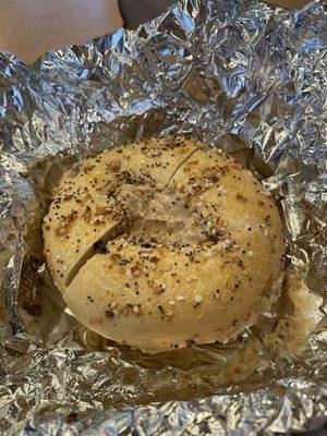 Supreme bagel with honey walnut spread.