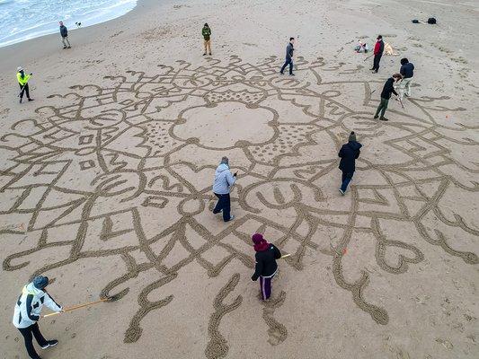 Team Building a beach mandala!