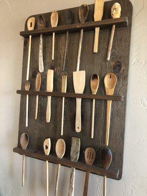 Wall decoration of wooden spoons in the restaurant.