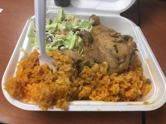 Chicken adobo plate with red rice and slaw.