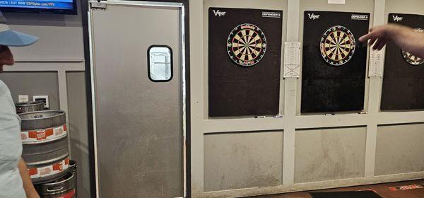 The door to the kitchen is by the dartboards! Yes, we had to keep moving out of the way.