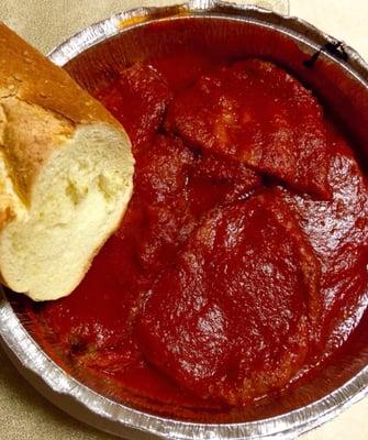 Takeout eggplant plate with some free bread-a large serving that is comforting and yummy.