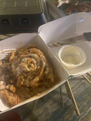 I spread the little container of frosting on the pecan Cinnabon.