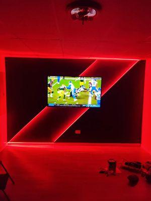 Tv mounted with LED accent wall