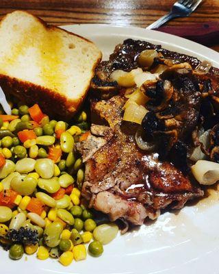 My 18oz big boy t bone steak with veggies and toast. Topped with shrooms and onions.