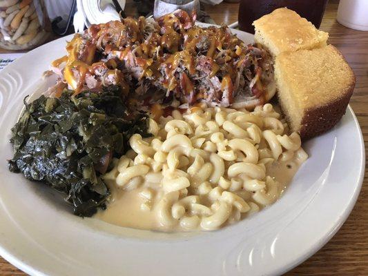 Pulled pork with Mac n cheese, greens and cornbread