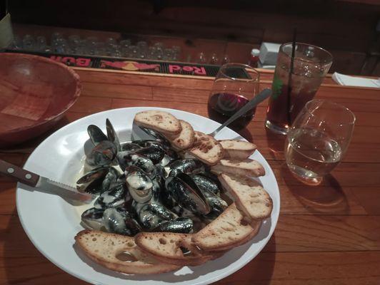 Menu mussels. Crowd.favorite. with a white wine cream sauce similar to Alfredo. Tasty.