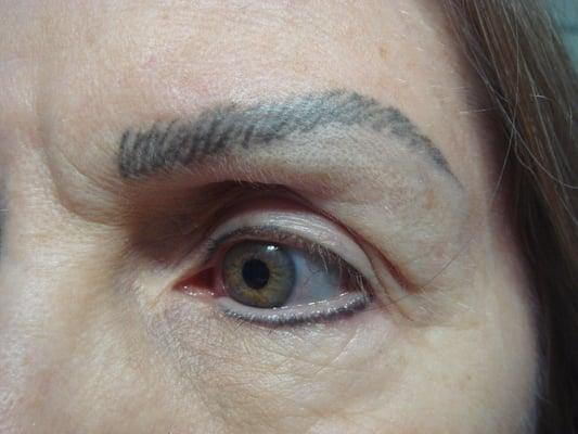 Left brow is shaped differently