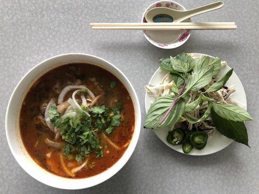 Bún Bò Huê - Spicy Beef Noodle Soup  Sliced Beef, Vietnamese Ham and Pig Trotters in a spicy soup base. $9.50