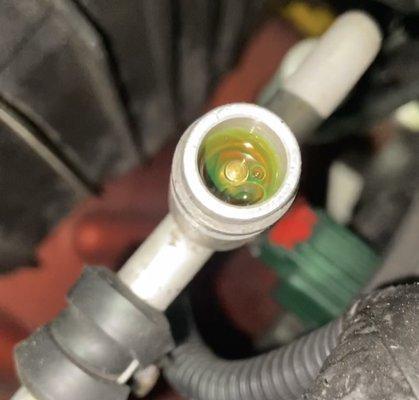 A/C refrigerant leak. The smallest of leaks will lead to poor cooling.