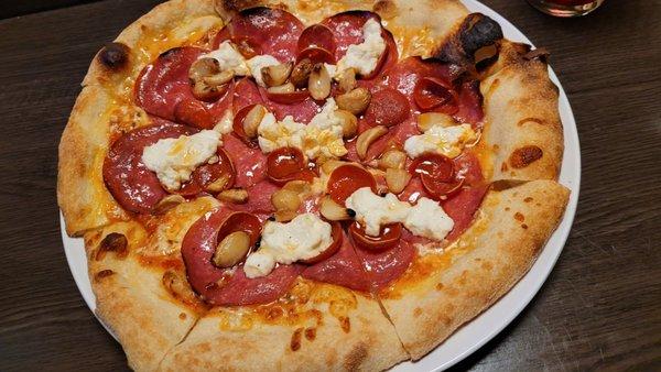 Pepperoni pizza with Ricotta and roasted garlic added.