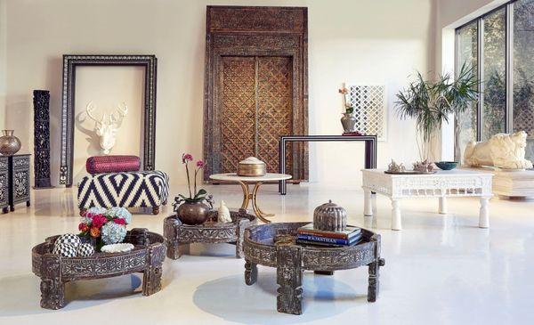 Hand-carved door with low coffee tables.