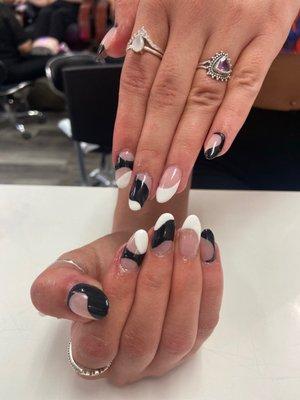 Abstract black and white rounded almond nails