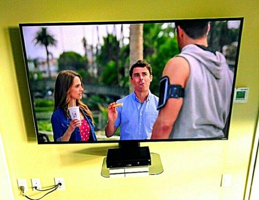 Tv mounted with articulating mount, and shelf, with hidden wires