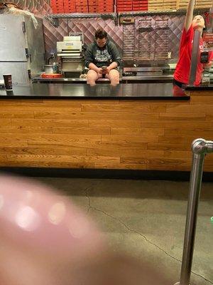 Employee still in counter! She did not care that there were patrons in the restaurant.