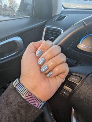 Gel Manicure with chrome in incandescent lighting