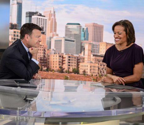 March 31, 2022 was Dawn Stevens's last day as an anchor on Fox 9. Tom Butler is smiling at her.