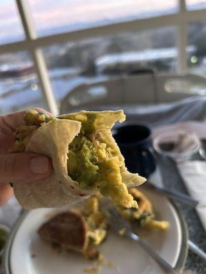 Breakfast scramble with sausage and guacamole makes a sweet taco!