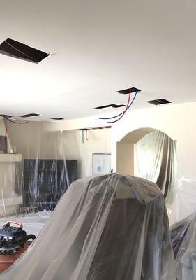 Repipe in Anaheim Hills in progress. Plastic hung everywhere and holes cut neatly.