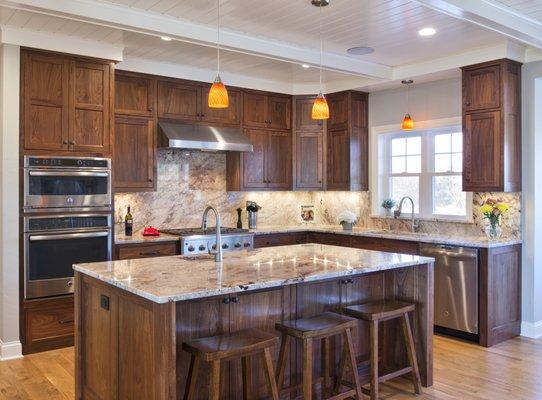 Stunning walnut custom kitchen! Decorative end panels, furniture style island and storage galore!!