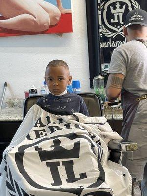 My son getting his first cut