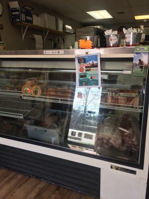 Local meats, eggs, honey, sauces, some produce, and smoked meats and prepared sides to-go.