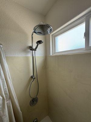 New shower head with rain head and hand held.