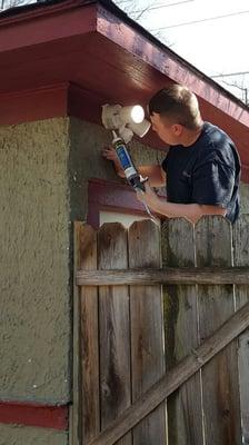 Mitch sealing a motion fixture from bugs and moisture.